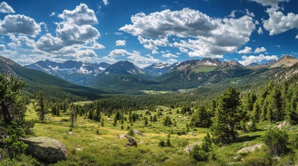 Obraz premium Breathtaking Mountain Landscape Under Blue Sky and Fluffy Clouds