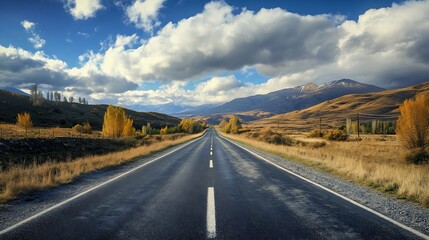 Empty Road Through Autumnal Mountains. Concept of Adventure, Freedom, and Travel.