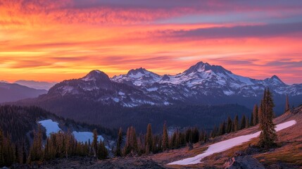 Obraz premium A breathtaking mountain landscape at sunset with vibrant colors and snowy peaks.