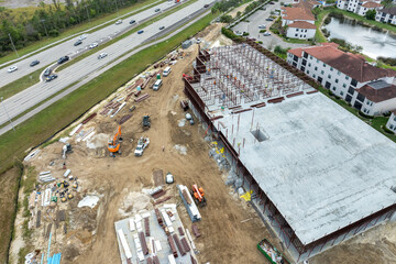Development of commercial housing in USA. Construction works on monolithic frame. Large building...