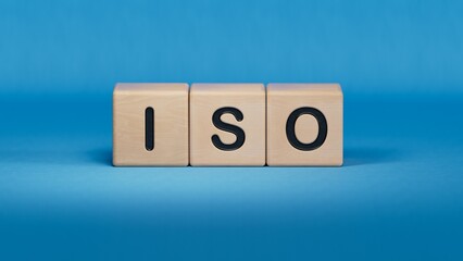 The abbreviation ISO on wooden cubes with check mark. ISO quality control certification approval concept.close up of wooden elements.3D rendering on blue background.