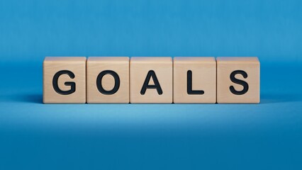 the word GOALS is written on a wooden cubes structure.close up of wooden elements,Business Concept.3D rendering on blue background.