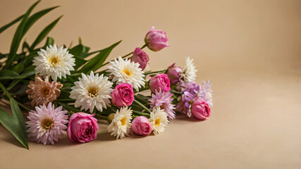 Obraz premium Lovely flowers against a beige background