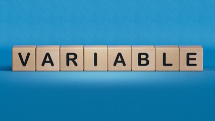 Word VARIABLE made with wood building blocks.close up of wooden elements,Business Concept.3D rendering on blue background.