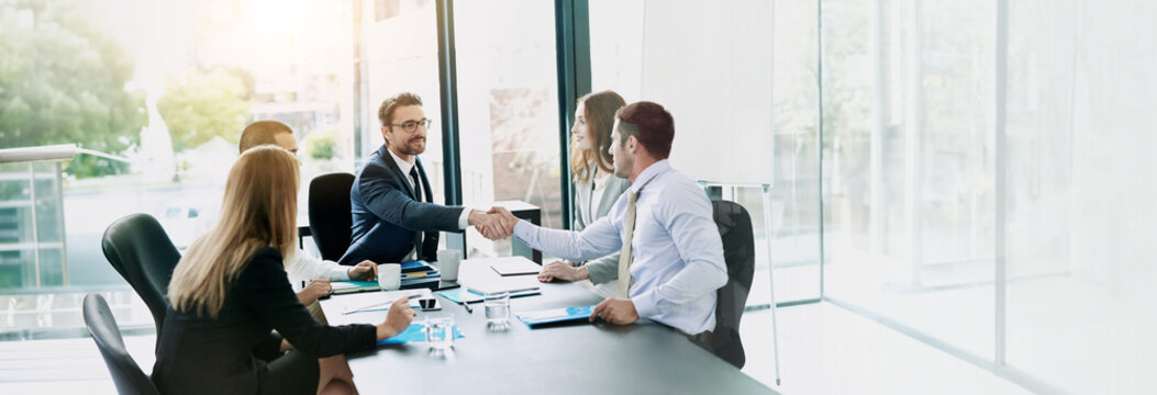 Agreement, meeting and business people with handshake in office, accounting firm and success for b2b deal. Boardroom, teamwork and accountants with shaking hands for welcome, greeting and thank you
