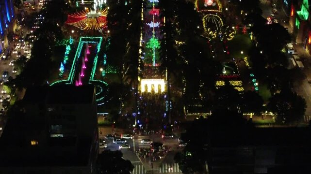 Drone aerial footage of Pra&ccedil;a da Liberdade in Belo Horizonte, Brazil, at night beautifully illuminated with festive Christmas lights. A stunning aerial view of holiday magic in Brazil&rsquo;s iconic square.
