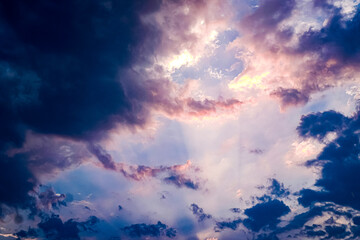 An atmospheric image of the sky and clouds after a rainstorm, where the sky begins to clear and...