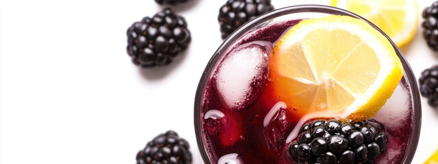 Refreshing blackberry lemonade with ice cubes, garnished with lemon slices, perfect for a summer day. Vibrant colors and fresh blackberries create a crisp image.