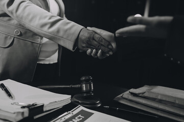 Judge gavel with Justice lawyers having team meeting at law firm background. Concepts of Law and Legal services.