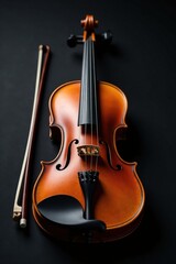 Fototapeta premium A single wooden violin placed on top of a black background with its bow rests in the foreground, center, craftsmanship