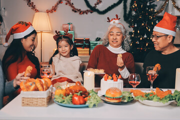 Happy multigeneration family enjoying in opening gifts on Christmas eve at home.