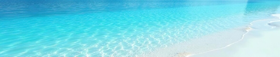Fototapeta premium Reflections in the calm blue water on a white beach, blue ocean, mirror-like surface, gentle ripples