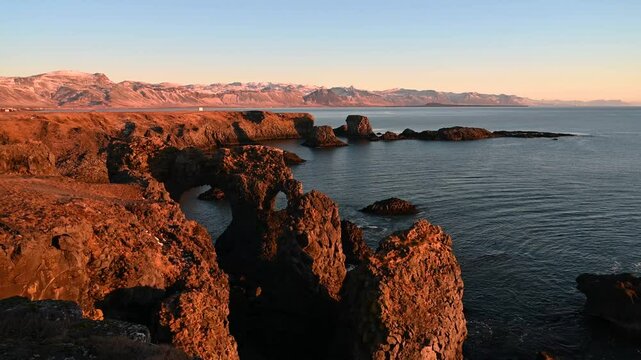Panoramic view of the ocean with sunrise scene on Arnarstapi, Iceland