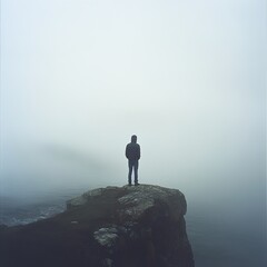 Solitude: A Man Contemplates Life on a Misty Clifftop
