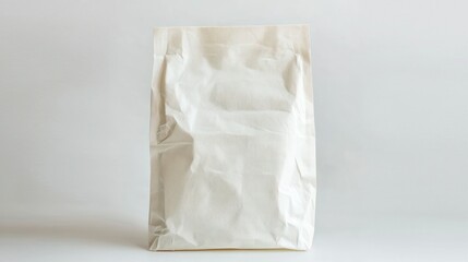 Obraz premium New Simple white paper carry bag with a classic design and subtle texture on a white background.
