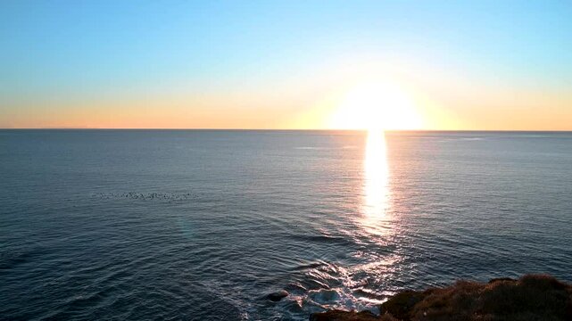 Panoramic view of the ocean with sunrise scene on Arnarstapi, Iceland