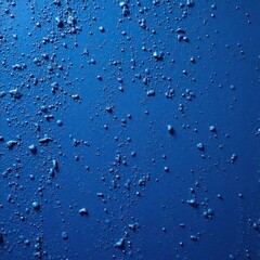 Dark blue background of a rustic stucco plaster wall, texture, grain