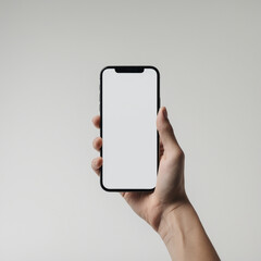 A image of a hand holding a modern smartphone with a blank white screen.