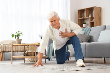 Mature man having heart attack at home