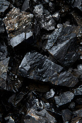 Detailed Close-up of Raw Coal Chunks with Varying Textures and Shades for Industrial Use