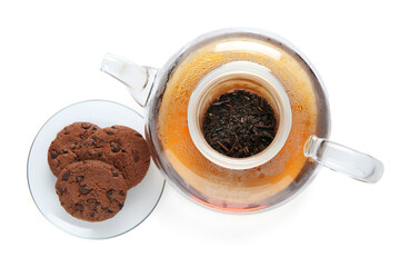 Glass teapot and saucer with cookies on white background. Top view