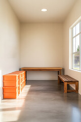 Fototapeta premium Bright and minimalist indoor space featuring wooden furniture and orange storage boxes