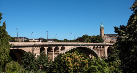 Fototapeta premium Scenic Adolphe Bridge and Spuerkeess Tower View on a Summer Day - Luxembourg City
