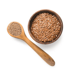 Bowl of flax seeds and wooden spoon with flour on white background