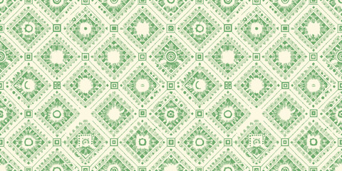 Elegant green and cream patterned fabric featuring intricate floral and geometric designs.