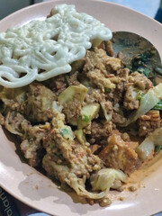 Rujak Cingur. Traditional Javanese food consisting of lontong with vegetables, peanut sauce, petis, tempeh, tofu, beef tongue, and crackers.