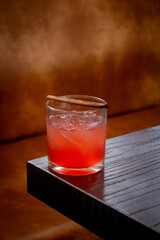 glass of red wine on wooden table