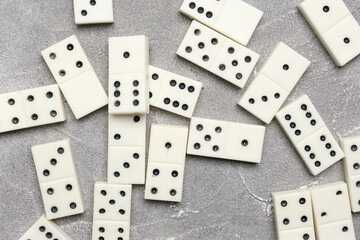 Many white dominos blocks on grey grunge background