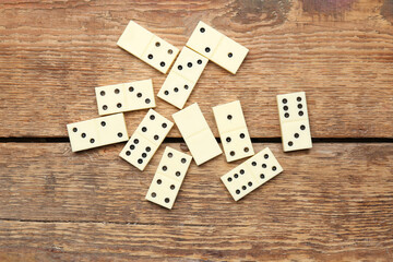 White dominos blocks on wooden background