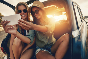 Travel, women and selfie at sunset for road trip and adventure in car for outdoor memory and holiday. Banner, girl friends or happy people in picture on summer vacation, photography and lens flare