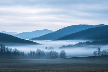vast view of mountains covered in blanket of fog minimal light and shadow creating serene atmosphere copy space in