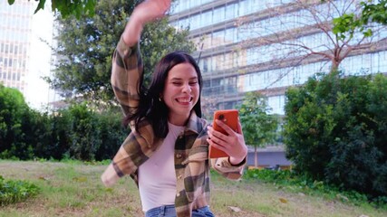 happy young woman wins with an online betting app.