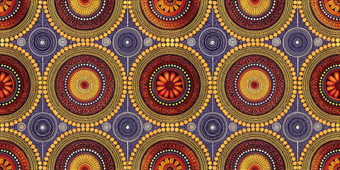 Fototapeta premium Colorful circular patterns in vibrant shades of red, orange, and yellow, creating a lively textile design.