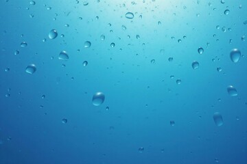 Macro View of Sparkling Water Droplets on a Cool Blue Backgroun