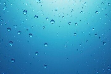 Shimmering Water Droplets on a Blue Background: A Stunning Close-Up of Freshness and Purity
