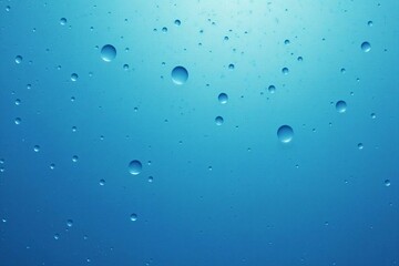 Shimmering Water Droplets on a Blue Background: A Stunning Close-Up of Freshness and Purity