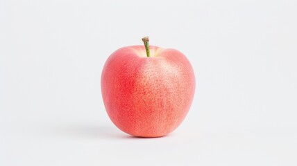 A single, vibrant red apple sits against a plain white background, showcasing its smooth texture and natural sheen.