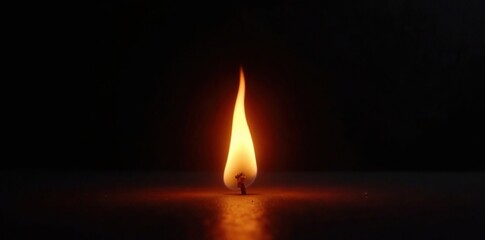 A small flame isolated on a black background with lower third exposure, element, flame