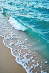 Ocean waves gently lapping against the shore at low tide, blue sea surface, wave motion