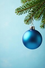Blue glass Christmas ornaments hanging from a fir branch, ball, holiday, festive