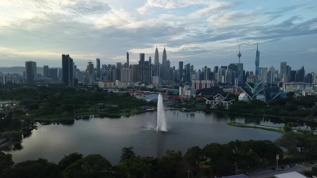 aerial view of kuala lumpur in the background with beautiful morning lark park scenery people jog