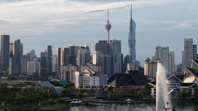 aerial view of kuala lumpur in the background with beautiful morning lark park scenery people jog