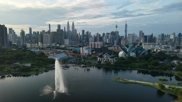 aerial view of kuala lumpur in the background with beautiful morning lark park scenery people jog