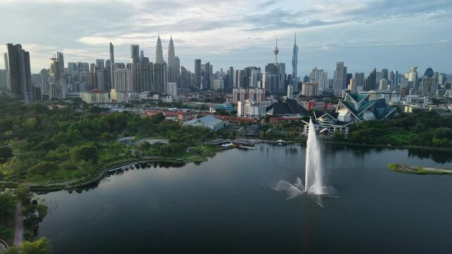 aerial view of kuala lumpur in the background with beautiful morning lark park scenery people jog