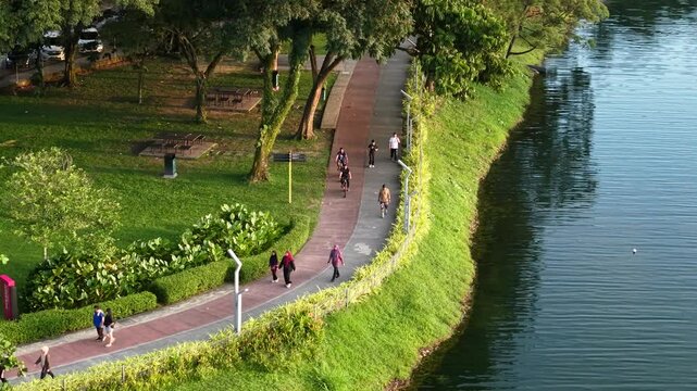 aerial view of kuala lumpur in the background with beautiful morning lark park scenery people jog