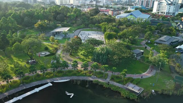 aerial view of kuala lumpur in the background with beautiful morning lark park scenery people jog